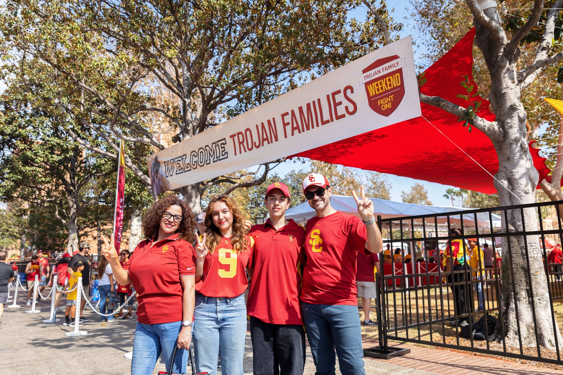 Trojan Families pose by Alumni Park 