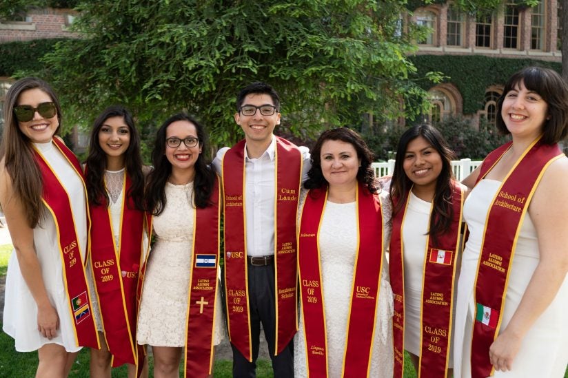 Trojans including women in white dress