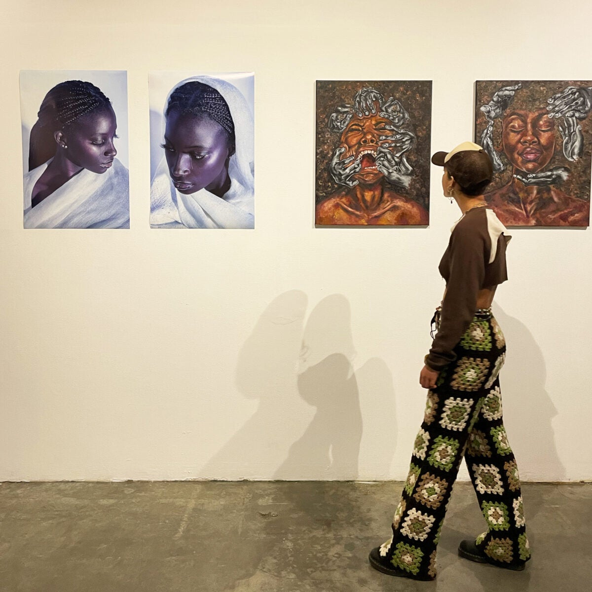 Visitor looks at new USC Roski exhibition, "The Black Experience."