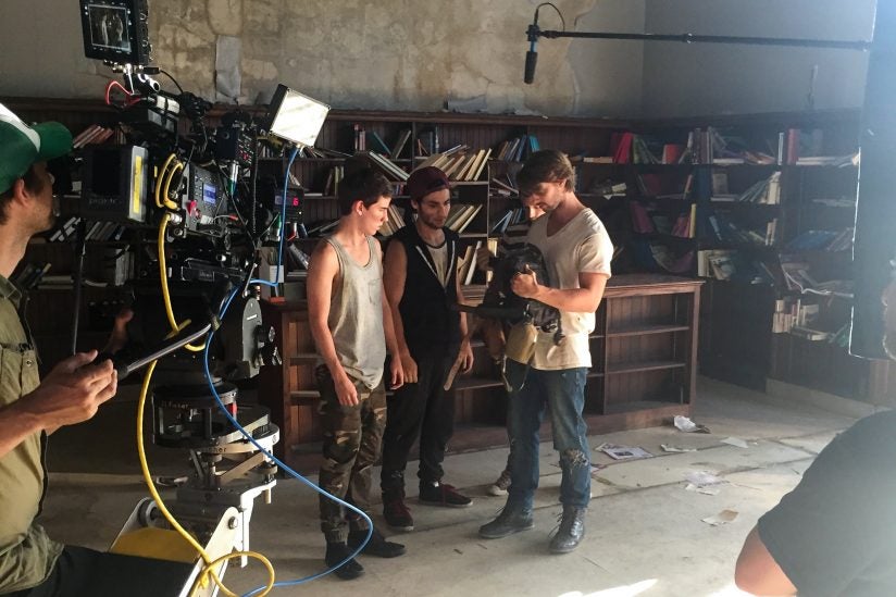 Atif Hashwi reviews notes between takes on set