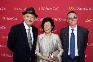 From left, philanthropists Kin-Chung Choi and Amy Choi with Andy McMahon, chair of the executive committee of USC Stem Cell. (Photo by Steve Cohn)