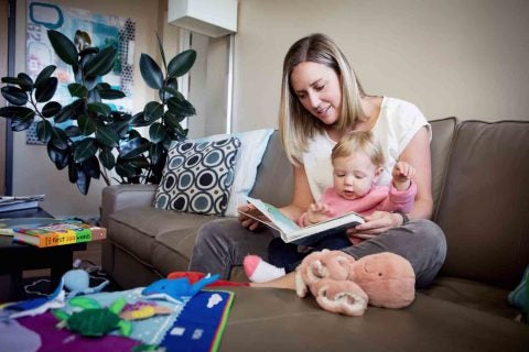 Myka Winder reads to her daughter Amelia