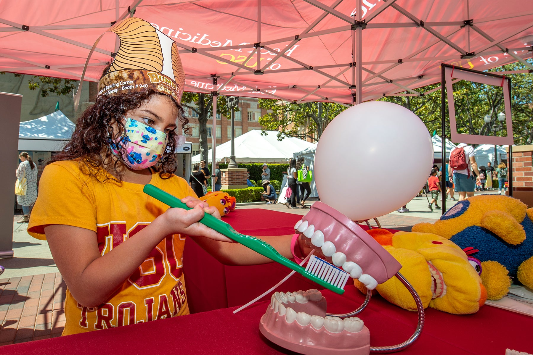 2022 Los Angeles Times Festival of Books: Youngster brushing giant model of teeth