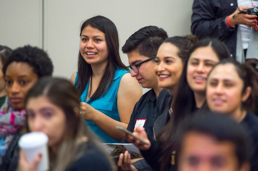 group of students in audience listening to speaker