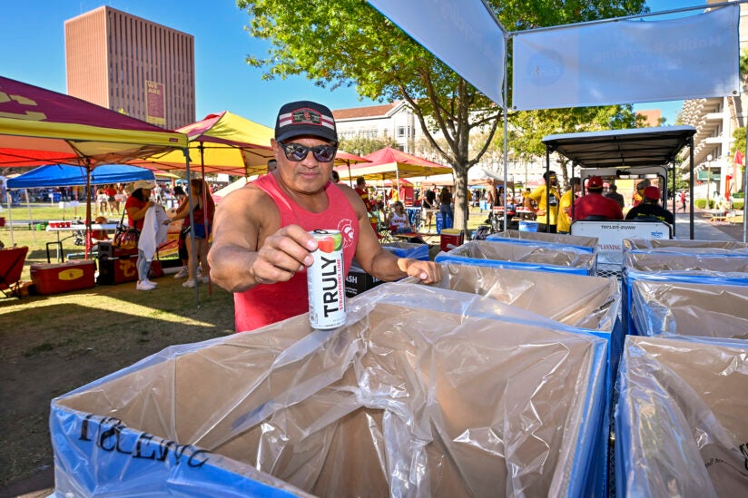 USC tailgating recycling: Frank Amador pitches in