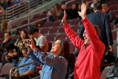 USC spring new student convocation: Family and friends wave to the new Trojans