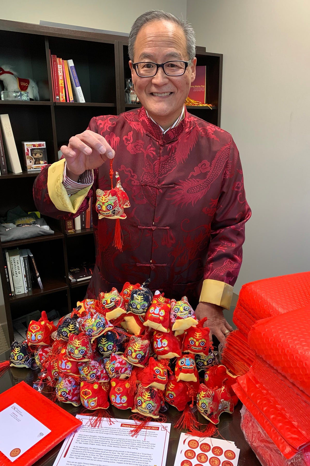 Lunar New Year: Blenn Osaki with small tiger mascots