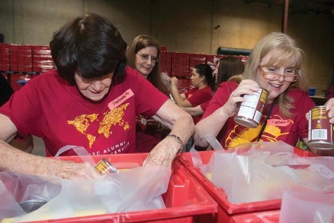 Food for All: Half Century Trojans and USC Caruso Catholic Center volunteers pitched in at the LA Regional Food Bank. 