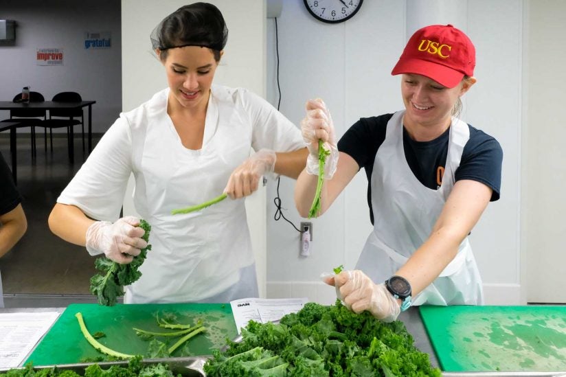 students preparing kale