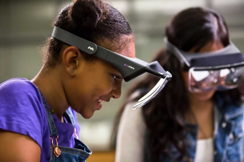 two girls wearing a Prism prototypes