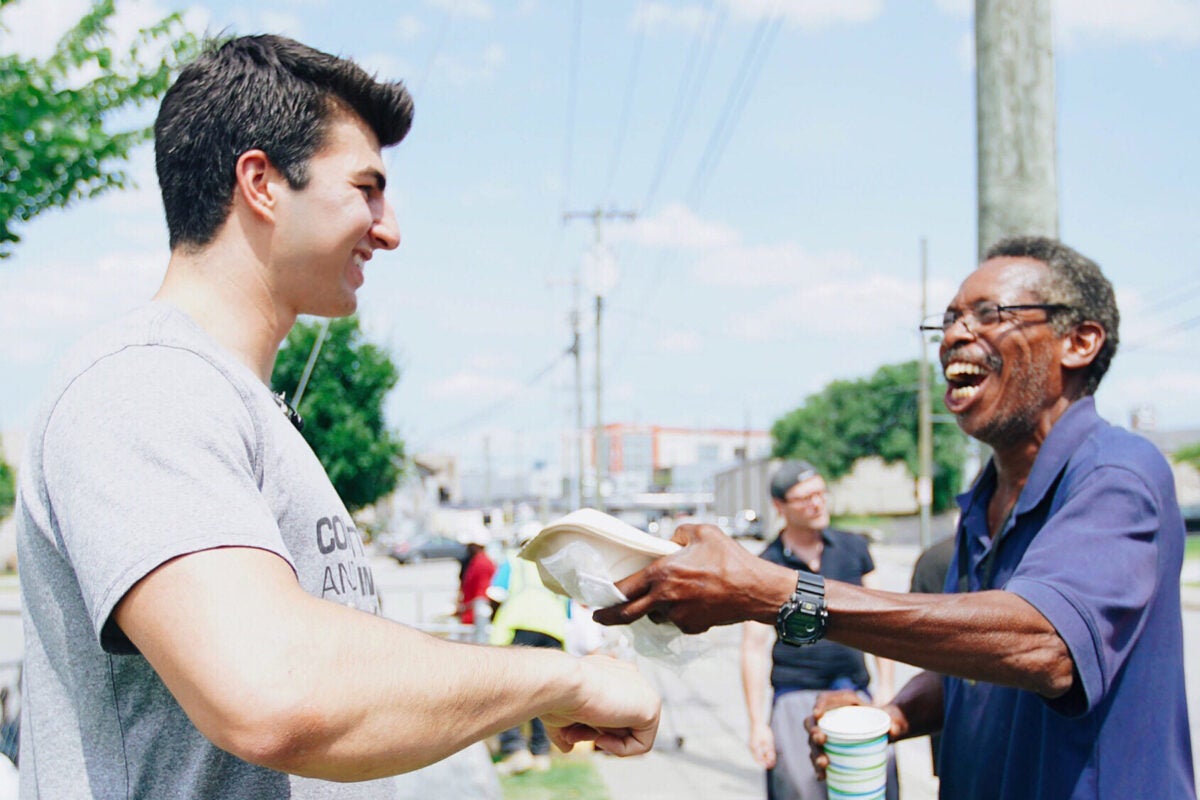 Student athlete Anthony “Mo” Hosan shares food from nonprofit on Skid Row