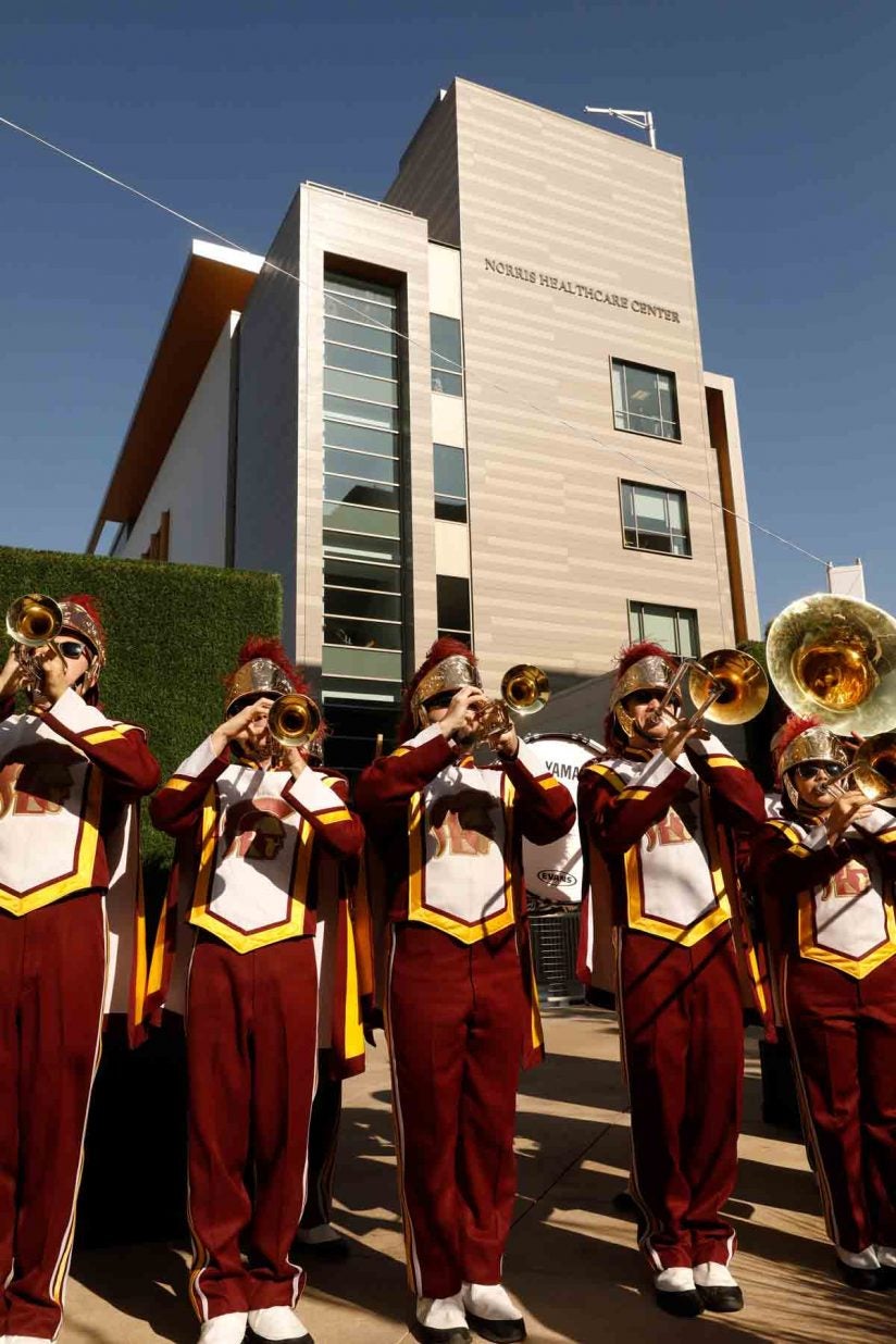 Trojan Marching Band with Norris Healthcare Center in background