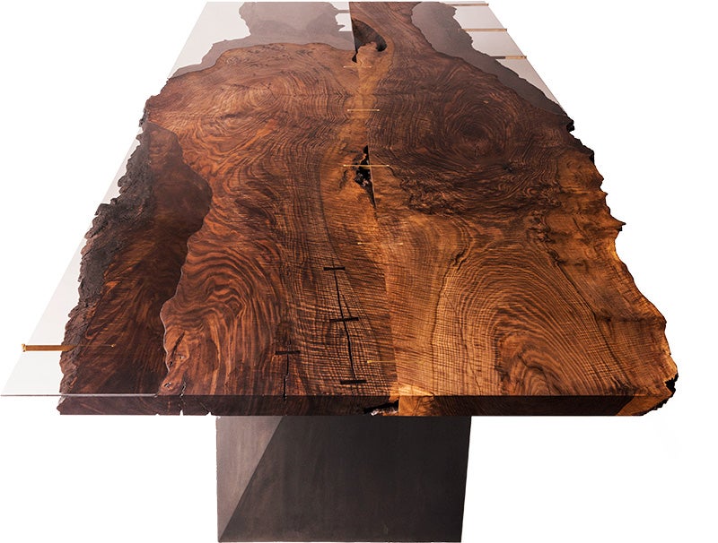 The Corset Table is made with a glass top that shows the wood's natural grains