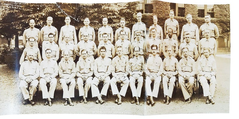 Ted Lumpkin in a black-and-white group shot with other military personnel in uniform.