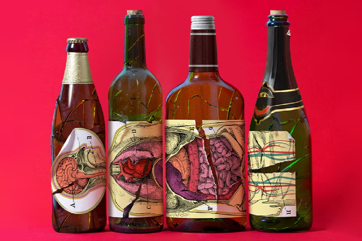 Four cracked bottles set against a red background with sticker labels of a human body diagram.