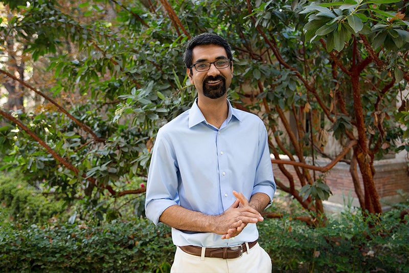 Portrait of Ramandeep Randhawa wearing a light blue shirt and khakis on the USC campus
