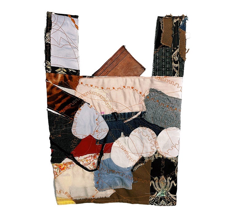 USC Roski student Paola Espinosa, this work uses repurposed discarded textiles. In quiltlike form, the trash is now a usable grocery bag.