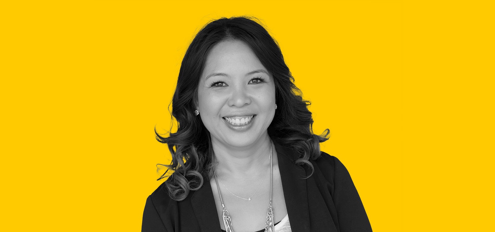 Cut-out black and white profile photo of Annalisa Enrile, Professor of social work at USC.