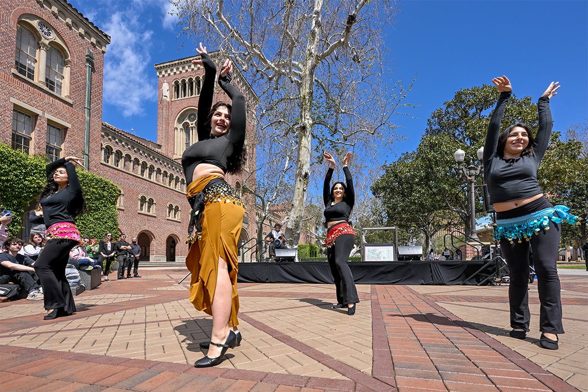Four dancers perform an Arabian dance at USC’s Arab American Heritage Month celebration.