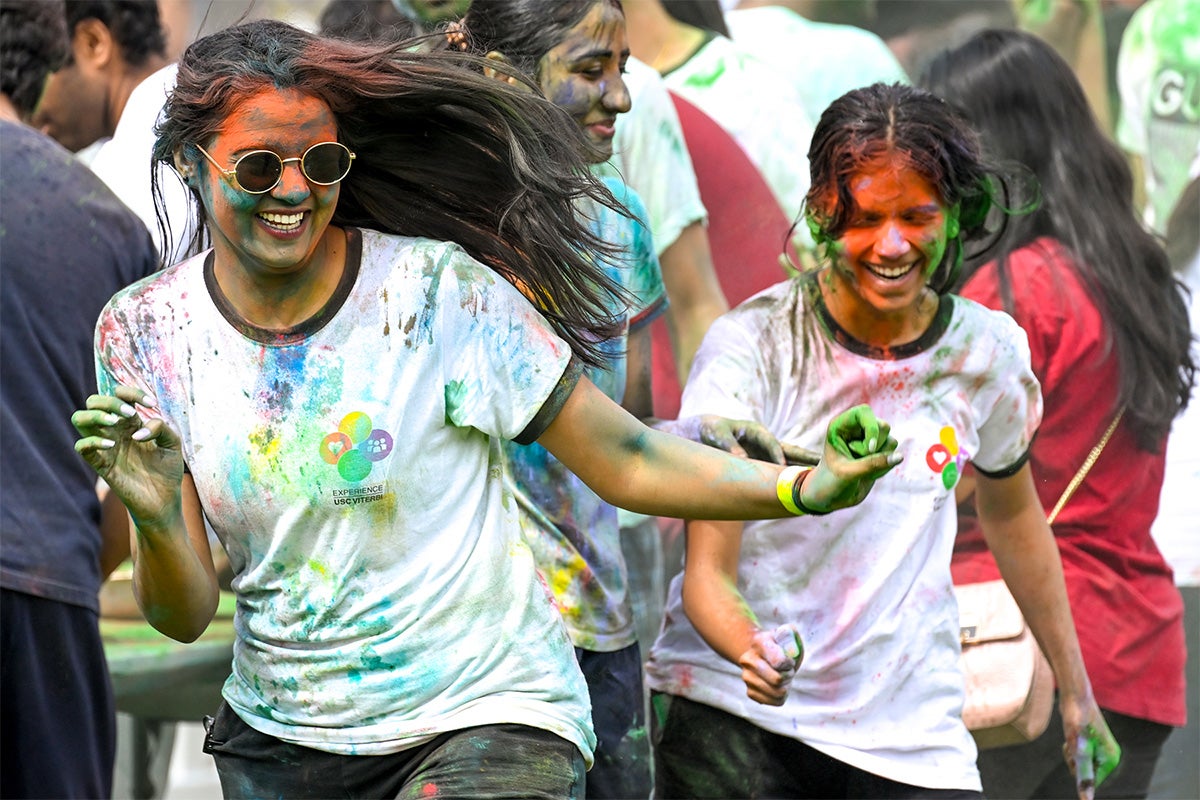 People are doused in colorful powders and water during Holi.