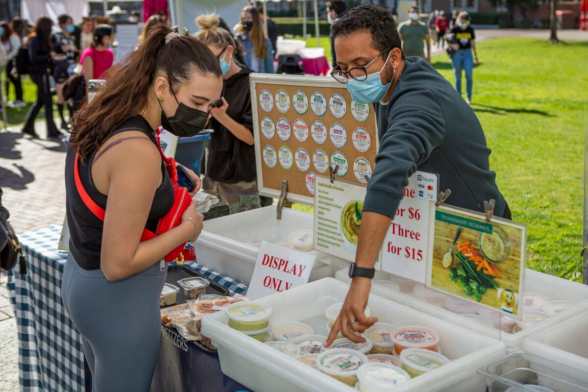 Anis Chafai and USC student Kati Chalabian at USC Trojan Farmers Market