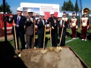 Los Angeles City Attorney Mike Feuer, left, Councilmember Curren Price, USC President C. L. Max Nikias, Los Angeles Interim Fire Chief James Featherstone and Councilmember Mitchell Englander break ground at the new USC Village fire station. (USC Photo/Dietmar Quistorf)