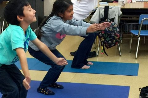 yoga at USC: kids doing yoga at Vermont Elementary school with JEP program