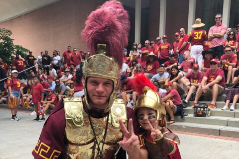 USC football fans: Julian Segura with USC drum major Chris Rick