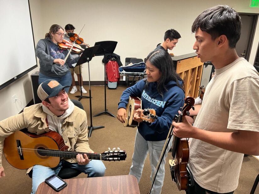 USC mariachi: José “Pepe” Romo, Daniela Santiago and Eduardo Cardenas