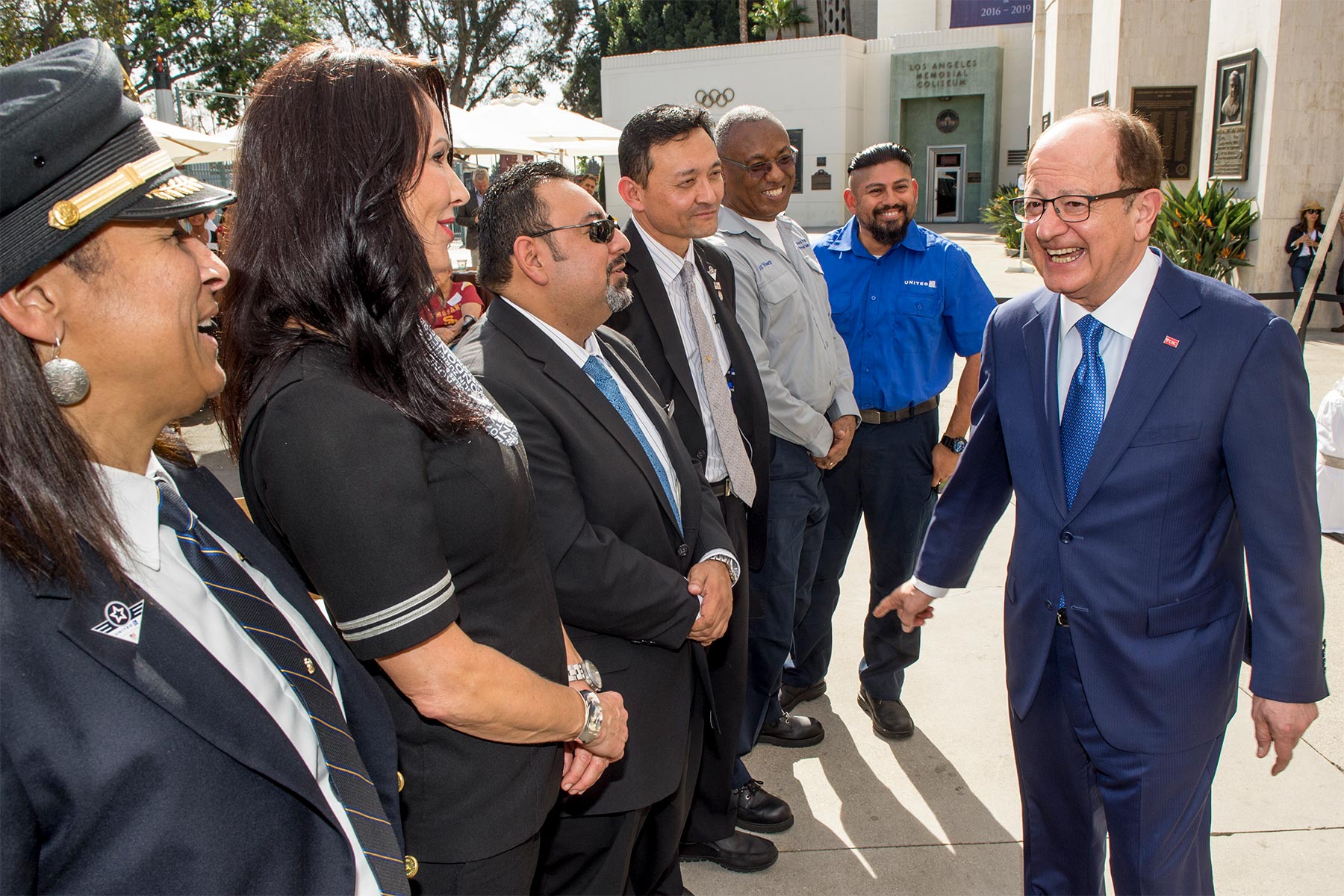 USC President C.L. Max Nikias greets United Airlines employees