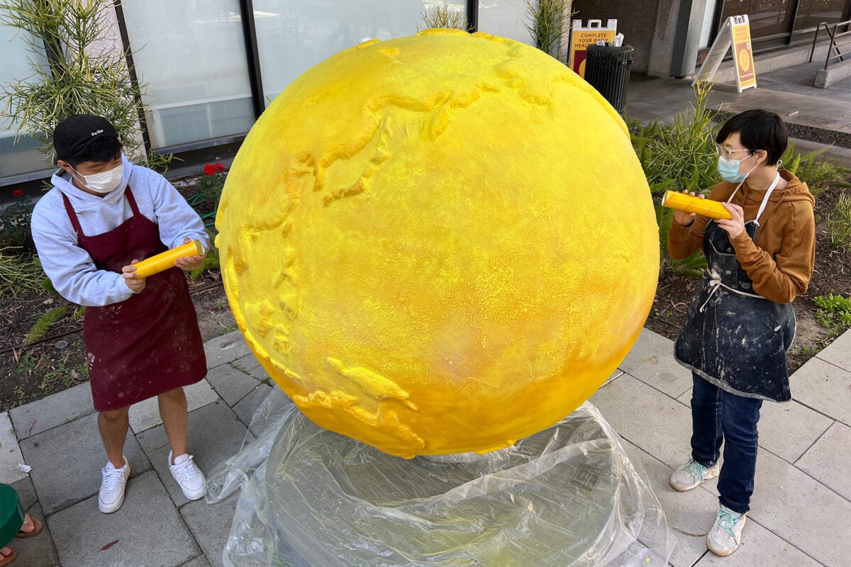 Art and climate change: Ethan Li and Lynn Tu work on one of the Cool Globes