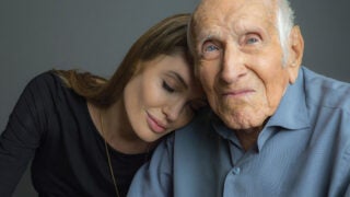 Angelina Jolie next to Louis Zamperini