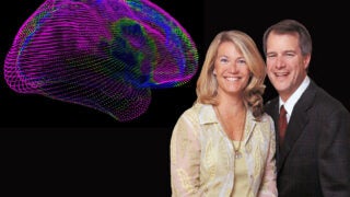 Mark and Mary Stevens next to a brain