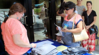 USC student helping parents at a high school