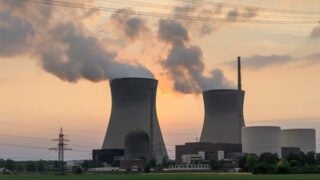 Nuclear power plant with smoking coming out from it