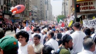 Crowded city street filled with parade goers