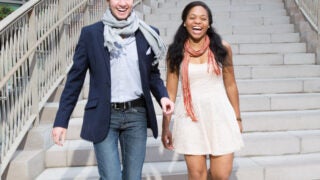Two students walking down stairs
