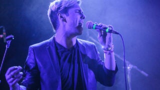 David Davila singing on stage