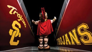 Tommy Trojan mascot entering the USC stadium through the teams entrance
