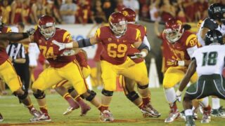 Cyrus Hobbi playing football in USC uniform