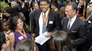 Neighborhood Academic Initiative scholars Jessica Alcazar and Tristan Baizar talk with Thomas S. Sayles