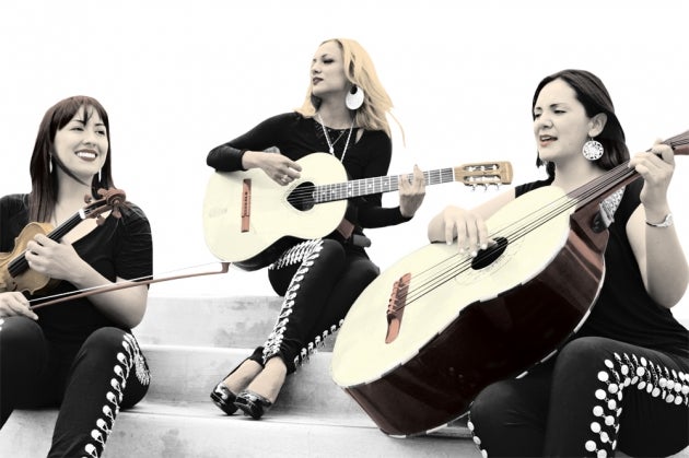 Suemy Gonzalez, left, with Trio Ellas.