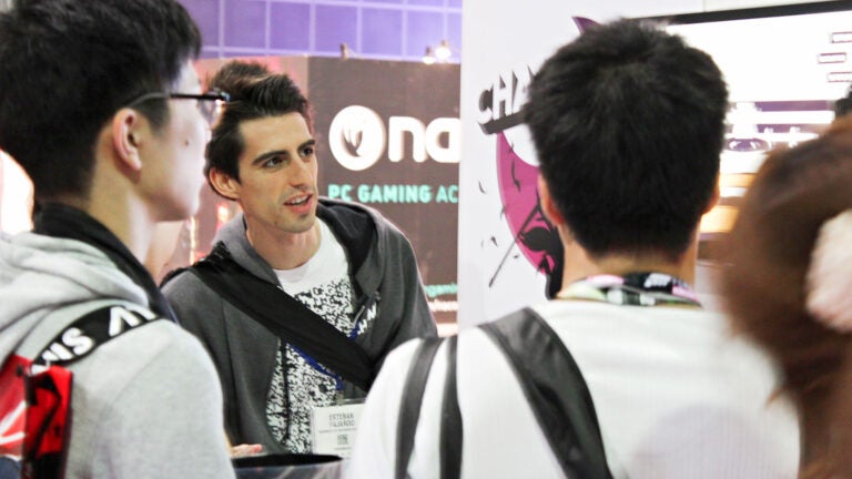 Students looking at gaming poster