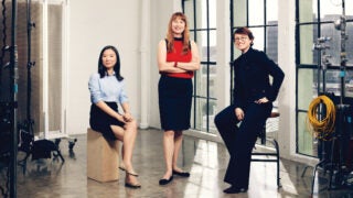 Three women engineers posing in a studio