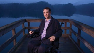 Ryan Williams in front of a lake