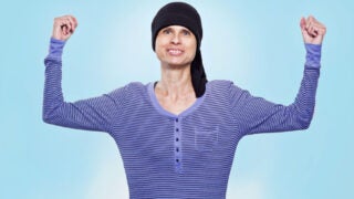 Cancer patient posing and showing her strength