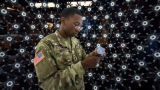 Military cadet looking at light stage