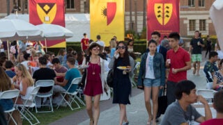Students eating outside on round tables