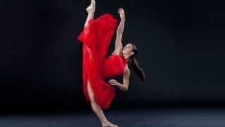Alyssa Allen in a red dress dancing