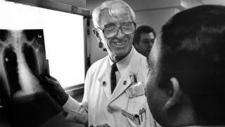 Peter Lee discusses an X-ray with colleagues